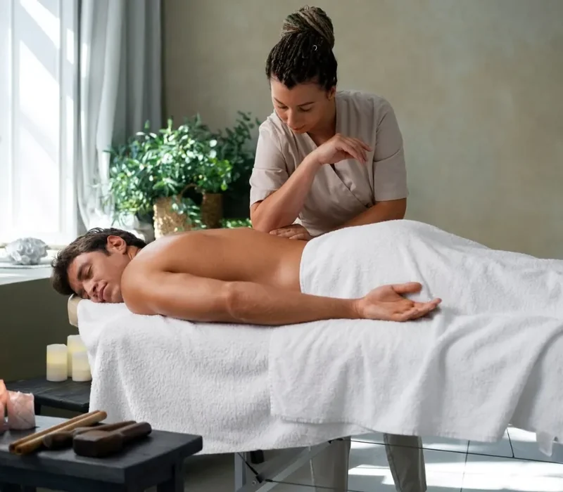 Therapist providing recovery-focused soft tissue massage