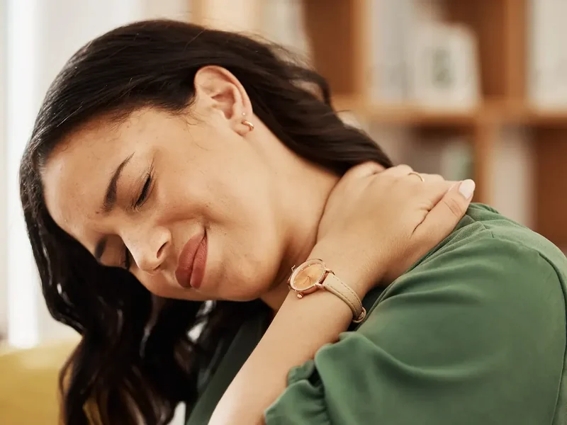 Physical therapist listening to a patient describe long-standing pain during an evaluation