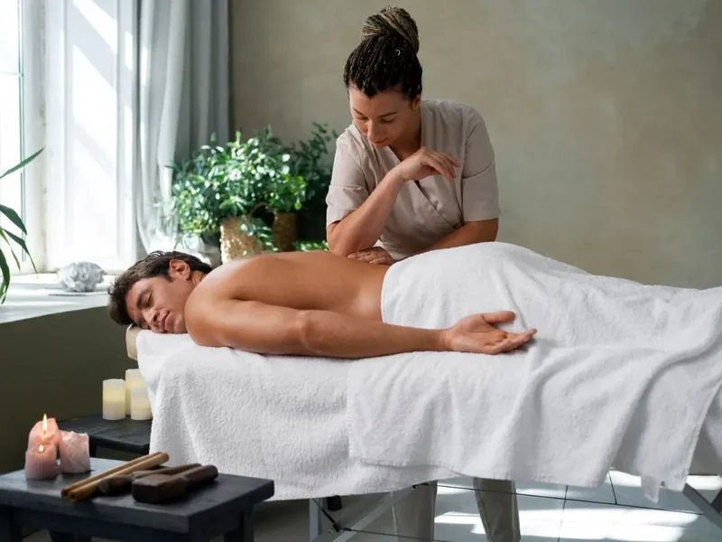 Licensed massage therapist working on a patient at Action Rehab in Honolulu