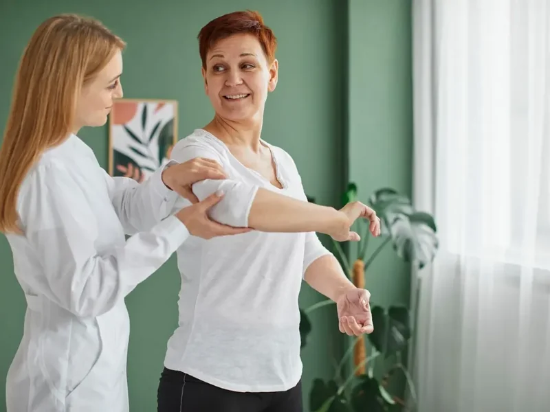 Licensed physical therapist working one-on-one with a patient at Action Rehab in Honolulu